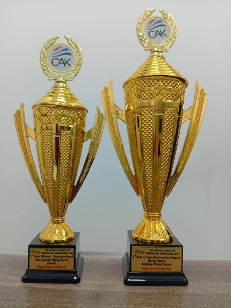 Unga Sacco side-by-side CAK award trophies from Ushirika Day 2024